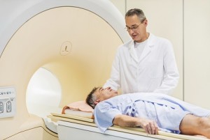 Mature doctor talking to his patient who is about to receive an MRI Scan.  [url=http://www.istockphoto.com/search/lightbox/9786662][img]http://dl.dropbox.com/u/40117171/medicine.jpg[/img][/url]
